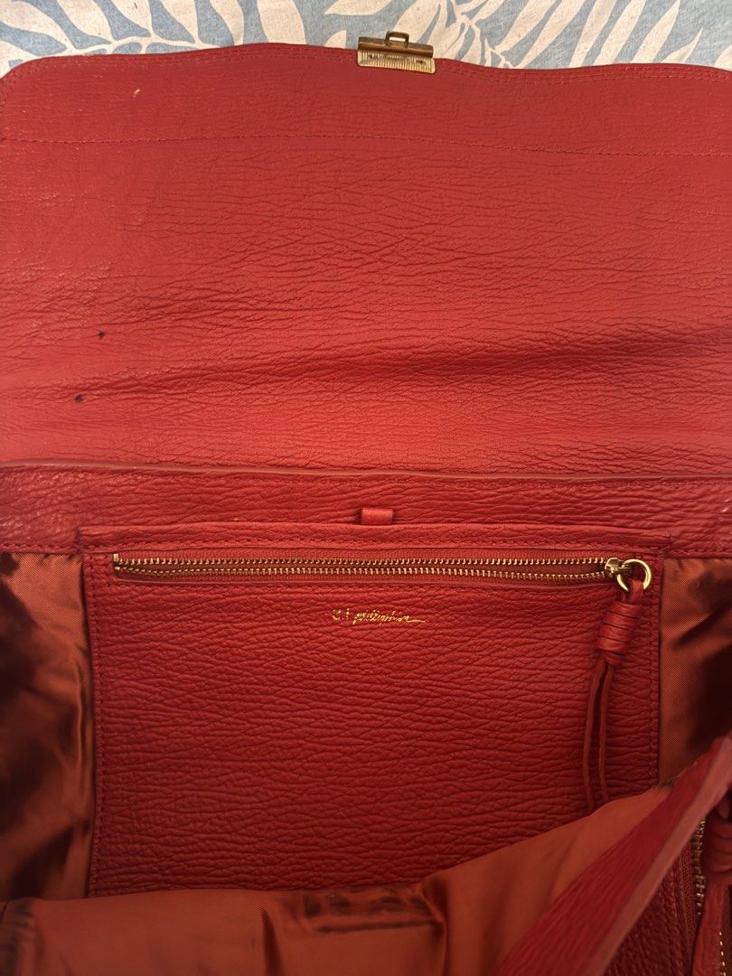 3.1 Phillip Lim Red Leather Handbag (Category: Luxury Bags & Wallets) located in Manila. Submitted by francisstein (Listing ID 1436891938, Image 3). Description: ✅Brand: 3.1 Phillip Lim ✅ Color: Red ✅ Material: Leather (Textured) ✅ Features: ✅ Flap closure with gold-tone lock ✅ Double top handles ✅ Two side zippers ✅ Interior and Exterior: Red ✅ The item is still in very good condition. ⛔️ Issue: The crossbody strap is no longer included as it ha