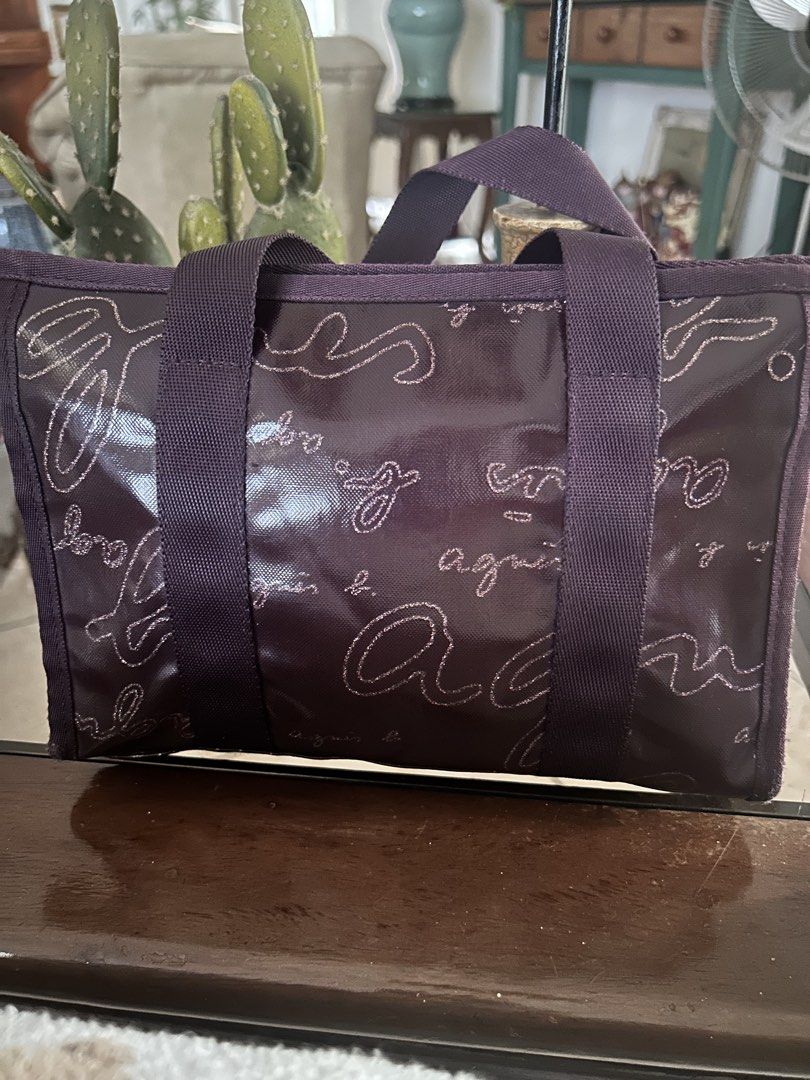 Agnes B. Voyage make up/ toiletry bag (Category: Tote Bags) located in Quezon City. Submitted by asiaco (Listing ID 1436844769, Image 1). Description: Agnes B. Voyage tote bag in purple. Features zip closure, spacious interior, and brand logo print. Includes charm. Ideal for daily use, can be used as a make up pouch too. .