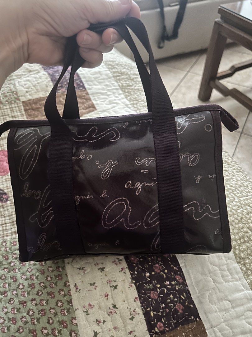 Agnes B. Voyage make up/ toiletry bag (Category: Tote Bags) located in Quezon City. Submitted by asiaco (Listing ID 1436844769, Image 2). Description: Agnes B. Voyage tote bag in purple. Features zip closure, spacious interior, and brand logo print. Includes charm. Ideal for daily use, can be used as a make up pouch too. .