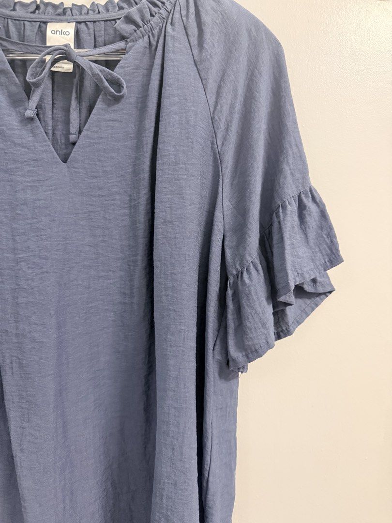 Anko Blue Ruffle Sleeve Blouse (size 8) (Category: Blouses) located in Bacoor. Submitted by wiseflower.a5d862 (Listing ID 1436941335, Image 2). Description: - Anko blue blouse - Size 8 - Ruffle sleeves - V-neckline - Tie detail at neckline - Textured fabric - Relaxed fit - Short, flared sleeves.
