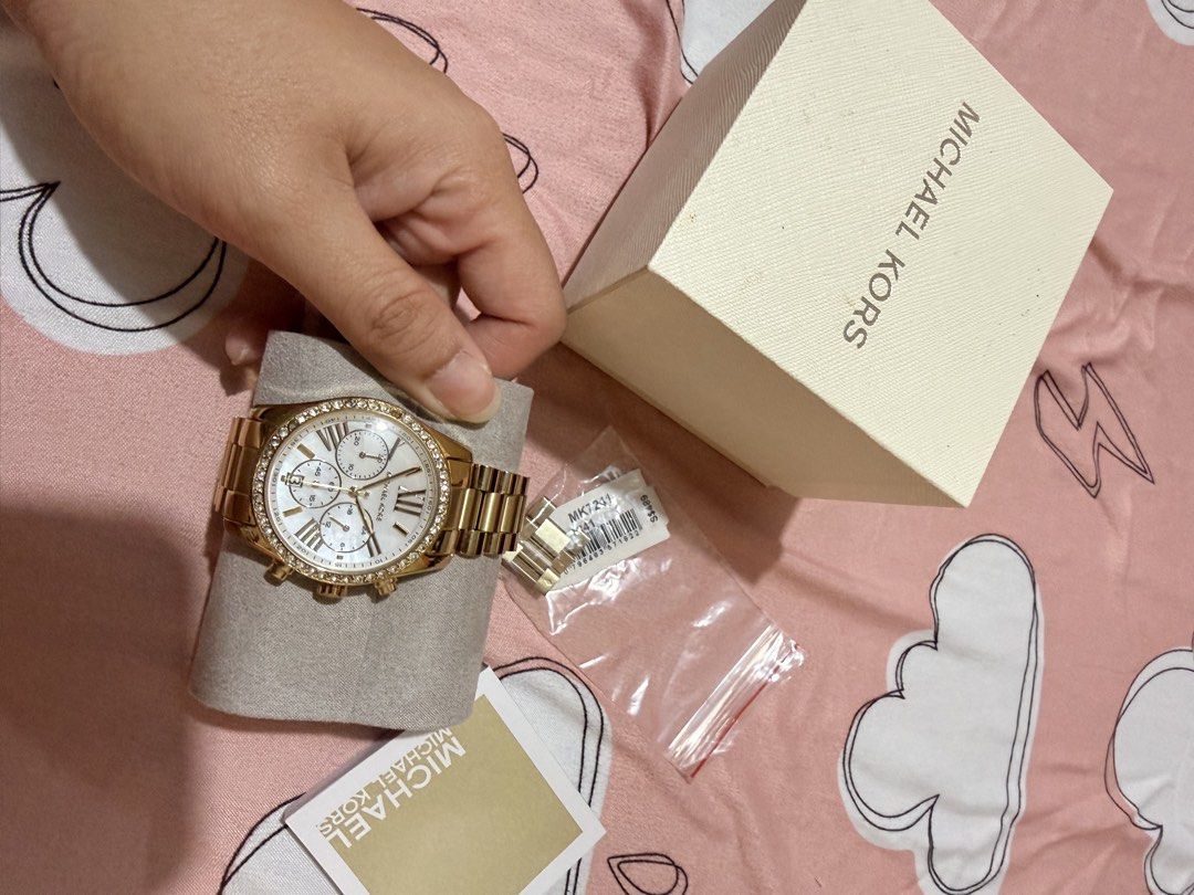 Authentic Michael Kors Gold Watch rarely used (Category: Women's Watches) located in Cabanatuan. Submitted by pixiecollections (Listing ID 1436879861, Image 3). Description: Authentic Michael Kors Watch bought from Singapore Rarely used Complete inclusions Last price only No haggling Rarely used Bought for 18k php RFS: decluttering.