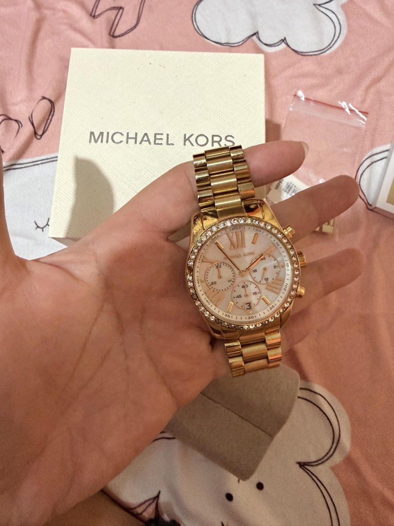 Authentic Michael Kors Gold Watch rarely used (Category: Women's Watches) located in Cabanatuan. Submitted by pixiecollections (Listing ID 1436879861, Image 1). Description: Authentic Michael Kors Watch bought from Singapore Rarely used Complete inclusions Last price only No haggling Rarely used Bought for 18k php RFS: decluttering.