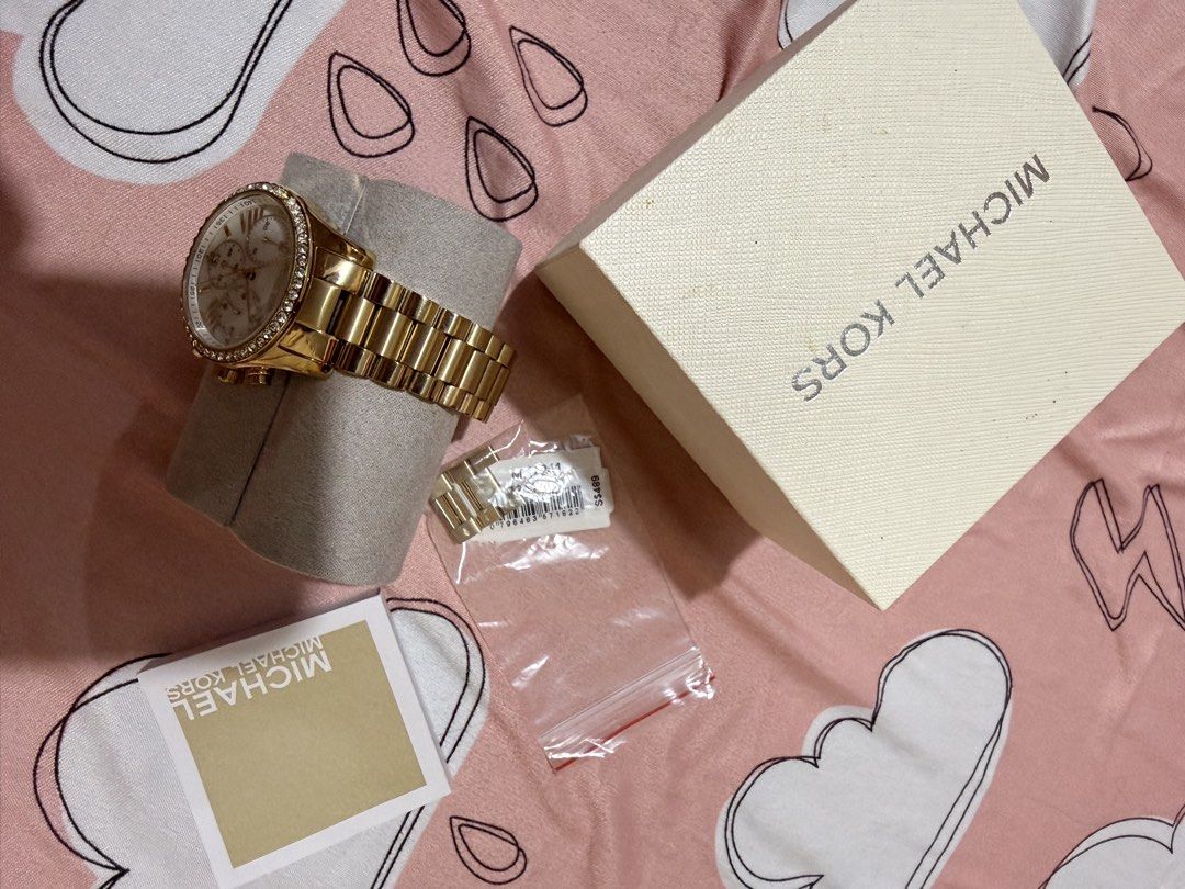 Authentic Michael Kors Gold Watch rarely used (Category: Women's Watches) located in Cabanatuan. Submitted by pixiecollections (Listing ID 1436879861, Image 2). Description: Authentic Michael Kors Watch bought from Singapore Rarely used Complete inclusions Last price only No haggling Rarely used Bought for 18k php RFS: decluttering.