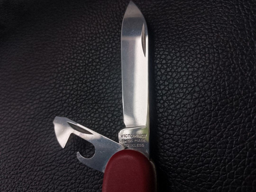 Authentic Victorinox Swiss Army Knife (Category: Hiking & Camping) located in Puerto Princesa. Submitted by stancy1986 (Listing ID 1436937596, Image 2). Description: Selling my authentic Victorinox! This is a great secondhand EDC (Everyday Carry) tool that is super slim and lightweight. It features a sharp main blade and the useful combo tool that works as a bottle opener and can opener. It’s been well-used but well-maintained, with everything st