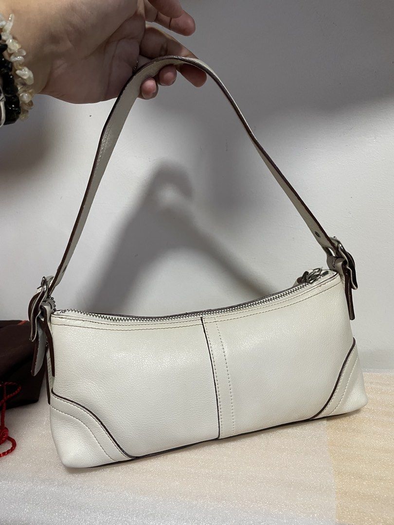 Authentic Vintage Coach Hampton Baguette (Category: Luxury Bags & Wallets) located in Guiguinto. Submitted by prelovedinc2024 (Listing ID 1436852950, Image 3). Description: guaranteed authentic, bought in Japan with signs of use - rubs, some scratches, stains/discoloration on some part, creases, imperfect rubber lining silver hardwares - no tarnish, but with scratches/hairlines last photo is only for reference size: 10x4.5x3”.