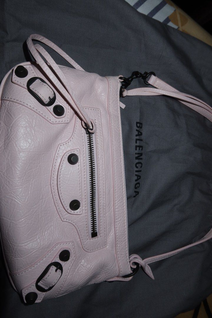 Balenciaga Le City Pouch On Strap (Category: Luxury Bags & Wallets) located in Las Pinas. Submitted by katrenperfar (Listing ID 1436831154, Image 2). Description: - Authentic Balenciaga Le City Pouch On Strap - Color: Petal Pink Features: -With Entrupy Certificate - Zip closure - Exterior zip pocket - Shoulder strap - Interior: Black - Hardware: Black - Material: Textured leather - Includes dust bag - Interior leather brand tag -sourced from Japa