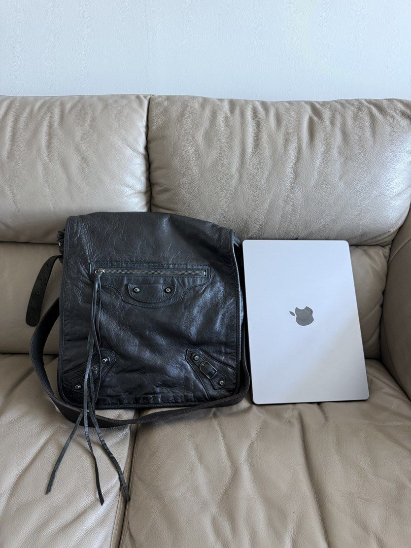Balenciaga Messenger Bag (Category: Luxury Bags & Wallets) located in Makati City. Submitted by markussangabriel (Listing ID 1436924255, Image 2). Description: - Balenciaga black leather messenger bag - Front zipper pocket - Adjustable shoulder strap - Flap closure - Spacious interior - Perfect for everyday use - Combines style and functionality.