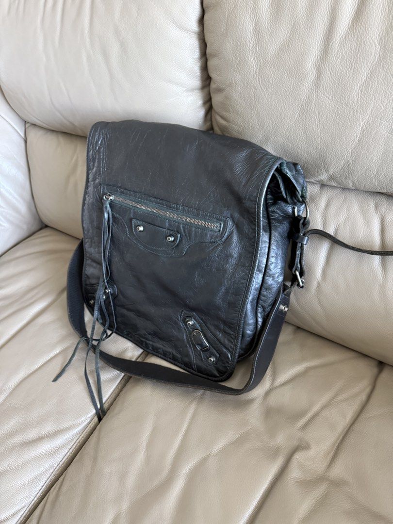 Balenciaga Messenger Bag (Category: Luxury Bags & Wallets) located in Makati City. Submitted by markussangabriel (Listing ID 1436924255, Image 3). Description: - Balenciaga black leather messenger bag - Front zipper pocket - Adjustable shoulder strap - Flap closure - Spacious interior - Perfect for everyday use - Combines style and functionality.