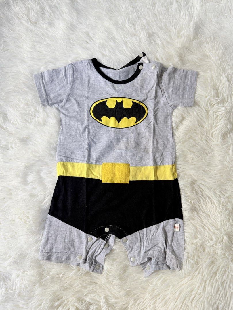 Batman Baby Romper 12-18M (Category: Babies & Kids Fashion) located in Bulacan. Submitted by ta.klowset (Listing ID 1436883619, Image 1). Description: - Adorable Batman baby romper - Features a gray top with Batman logo - Includes a yellow belt and black bottom - Snap closures for easy dressing and diaper changes - Perfect for your little superhero!.