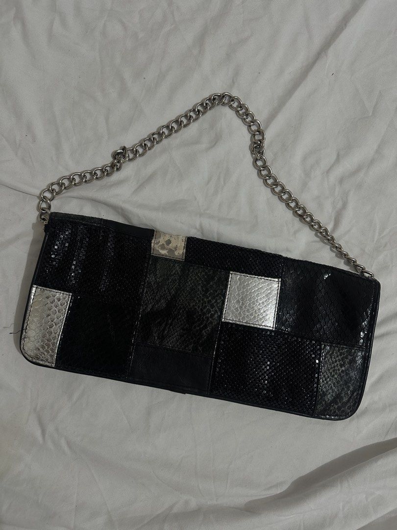Bebe Black Patchwork Clutch with Chain Strap (Category: Clutches) located in Manila. Submitted by rfibe (Listing ID 1437005214, Image 3). Description: - Bebe patchwork clutch - Black and silver design - Silver chain strap - Zipper closure - Black interior - Bebe logo inside - Perfect for any occasion.