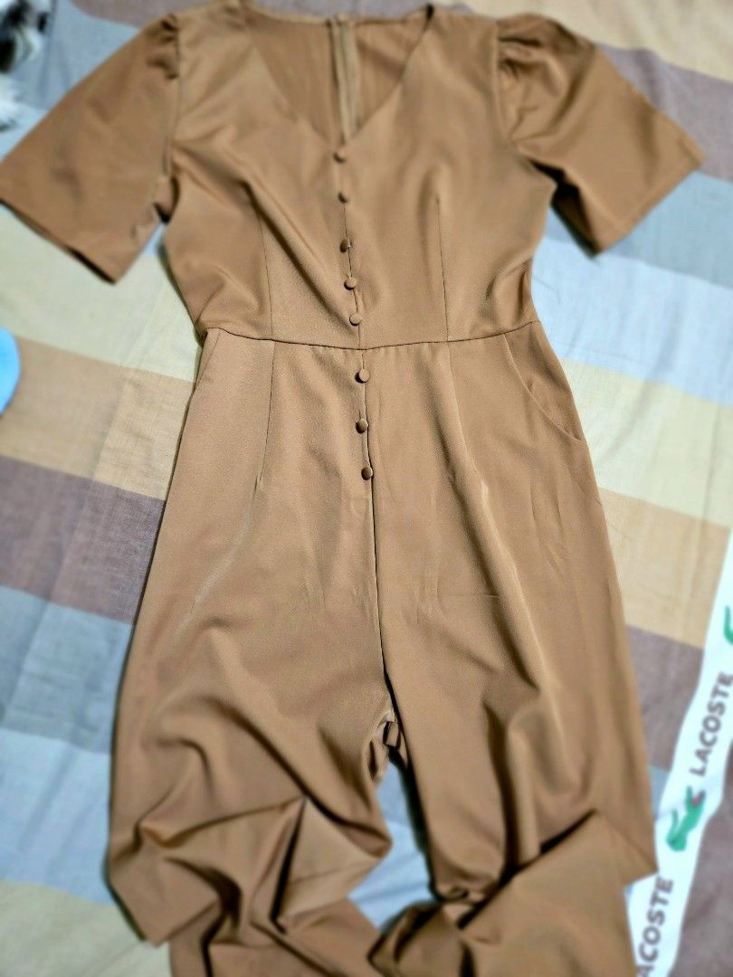 BKK Brown V-neck Jumpsuit (Category: Jumpsuits) located in Manila. Submitted by bubba20 (Listing ID 1436917070, Image 2). Description: - BKK Brown jumpsuit -brown - V-neckline - Short sleeves - Button-down front - Zipper closure - Smooth fabric - Tailored fit - Wide legs - Suitable for various occasions also available in baby blue shade.