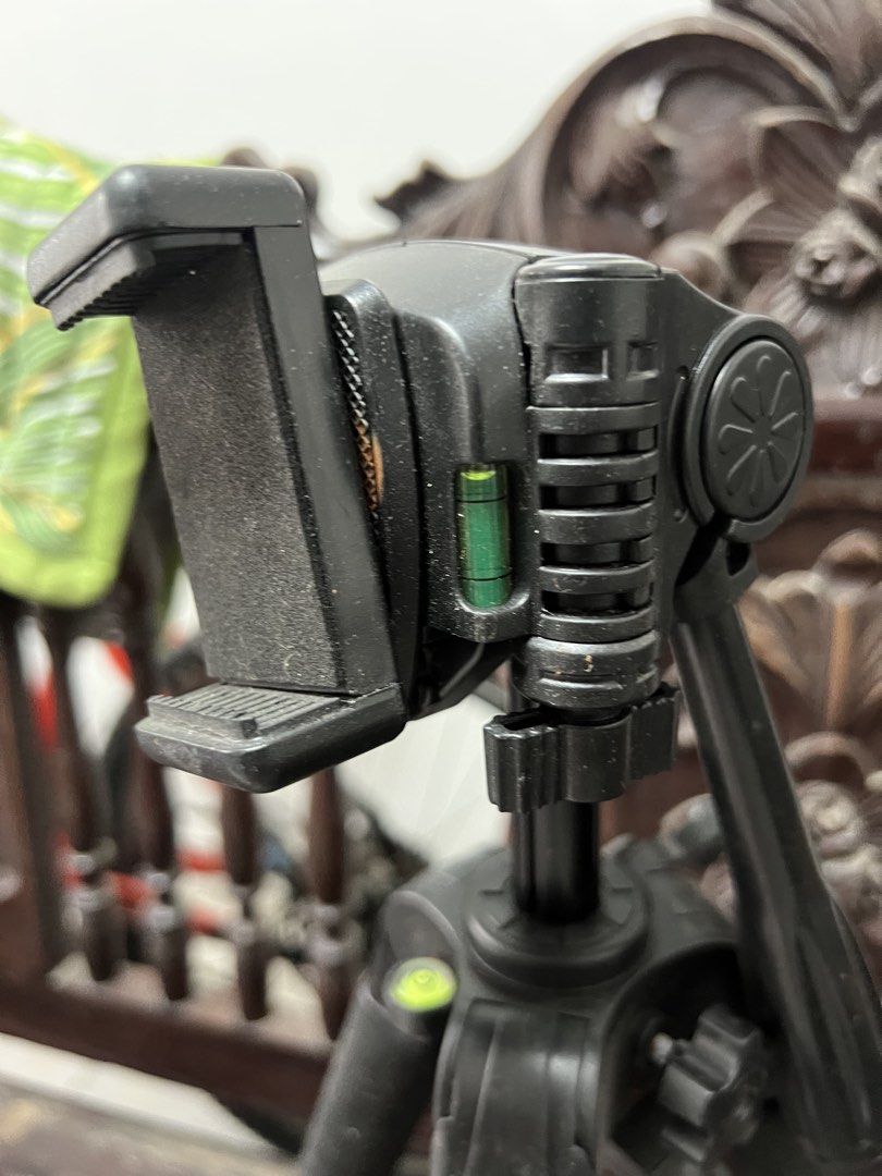 Black Tripod with Phone Holder (Category: Tripods & Monopods) located in Quezon City. Submitted by itsmecece (Listing ID 1436858179, Image 3). Description: Black tripod with phone holder and bubble level. Adjustable legs for stability. Perfect for photos and videos with your smartphone..