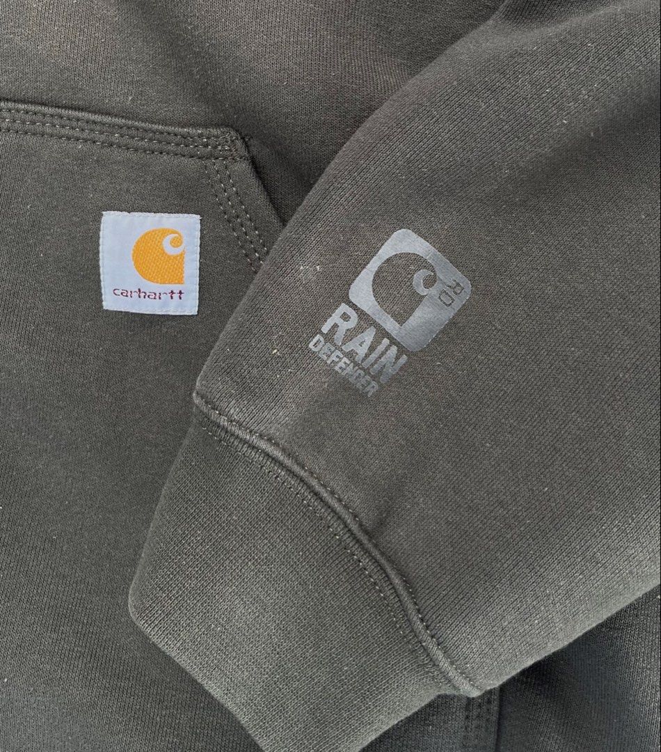 Carhartt Rain Defender Hoodie Jacket - Large (Category: Coats, Jackets and Outerwear) located in Pontevedra. Submitted by thrift01 (Listing ID 1436879653, Image 2). Description: - Carhartt hoodie jacket in olive green - Size: Large Regular - Features: - Full zip - Hood with drawstring - Two front pockets - Rain Defender logo on left sleeve - Interior lining: Dark fabric - Material: 50% cotton, 50% polyester.