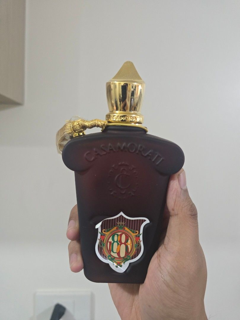 Casamorati 1888 Eau de Parfum 100ml (Category: Fragrance & Deodorants) located in Quezon City. Submitted by thelegallabel (Listing ID 1436849730, Image 3). Description: - Casamorati 1888 Eau de Parfum - 100ml bottle - Dark brown bottle with gold cap and tassel - Comes in original white box with brown and gold emblem - few sprays missing.
