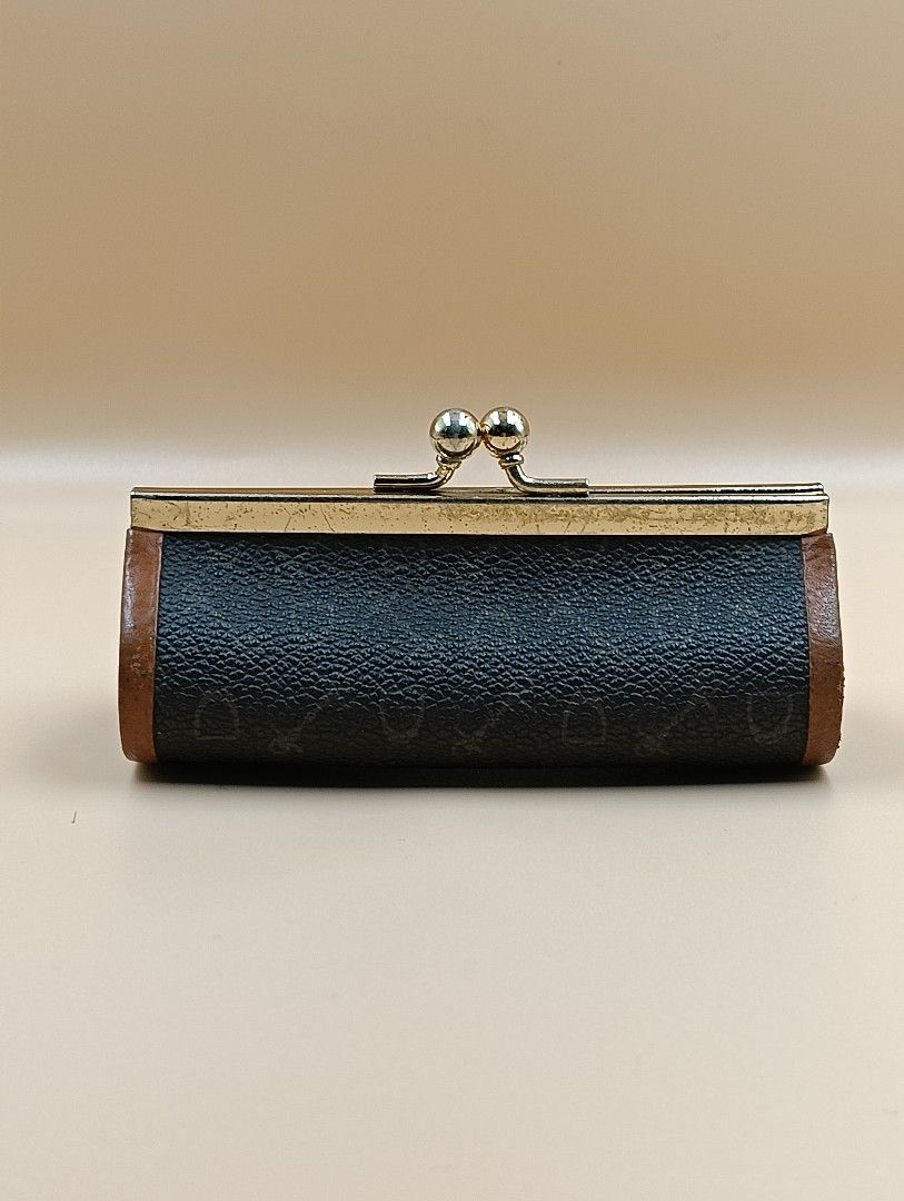 Celine Coin Purse (Category: Luxury Bags & Wallets) located in La Trinidad. Submitted by cherishedtreasures (Listing ID 1436990387, Image 2). Description: - Vintage Celine coin purse - Cylindrical shape - Brown patterned exterior - Brown leather trim - Brown interior - Gold-tone metal frame and kiss-lock closure.