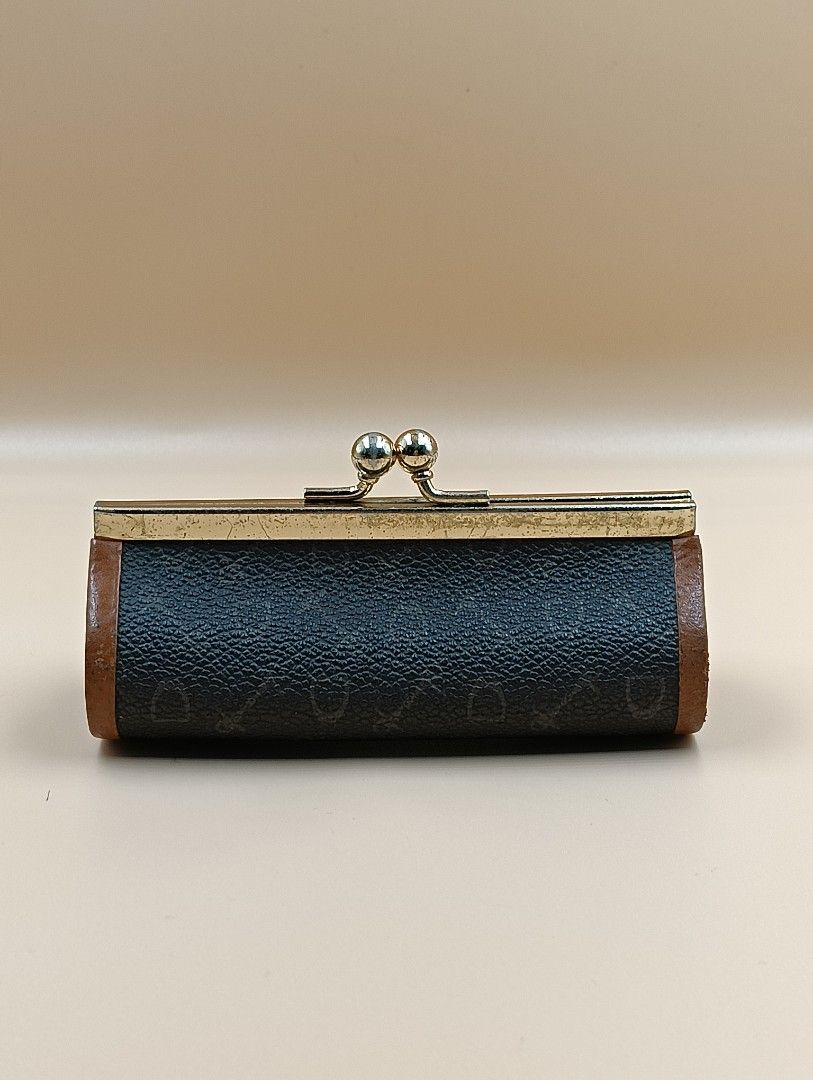 Celine Coin Purse (Category: Luxury Bags & Wallets) located in La Trinidad. Submitted by cherishedtreasures (Listing ID 1436990387, Image 3). Description: - Vintage Celine coin purse - Cylindrical shape - Brown patterned exterior - Brown leather trim - Brown interior - Gold-tone metal frame and kiss-lock closure.