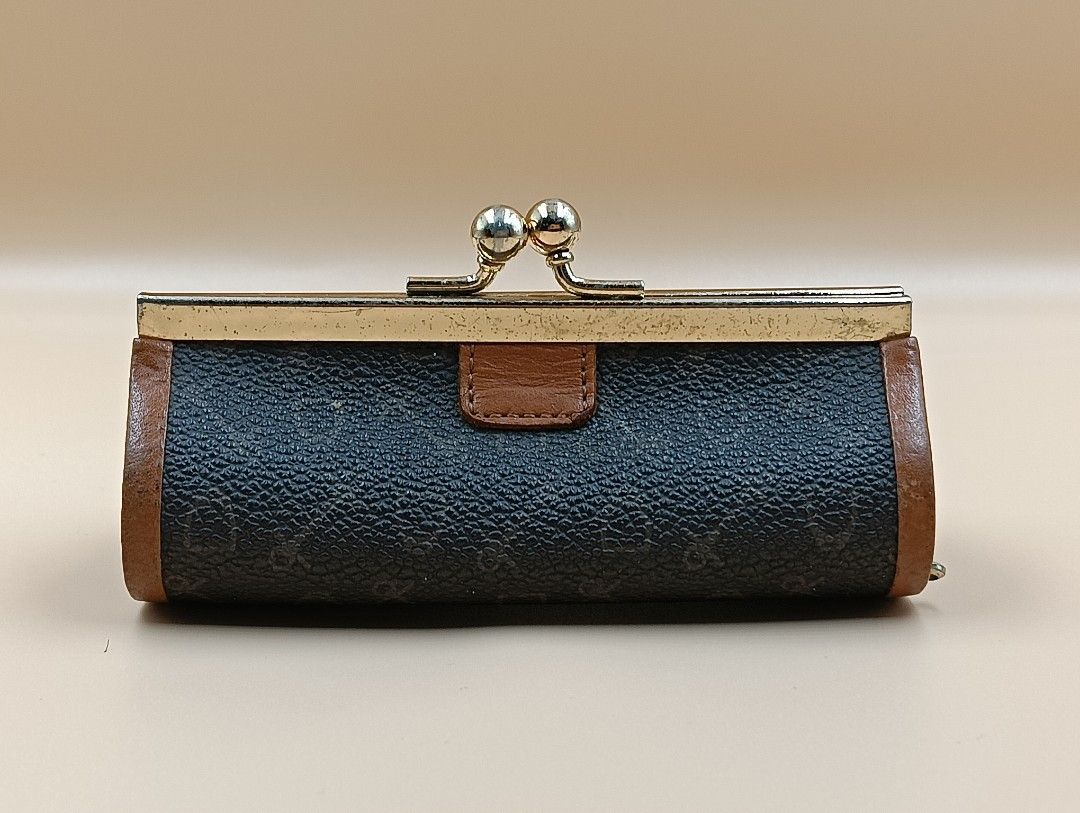 Celine Coin Purse (Category: Luxury Bags & Wallets) located in La Trinidad. Submitted by cherishedtreasures (Listing ID 1436990387, Image 1). Description: - Vintage Celine coin purse - Cylindrical shape - Brown patterned exterior - Brown leather trim - Brown interior - Gold-tone metal frame and kiss-lock closure.