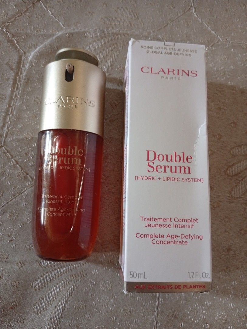 Clarins double serum complete age defying concentrate (Category: Face Care) located in Quezon City. Submitted by purple_haven (Listing ID 1434384974, Image 1). Description: Clarins double serum complete age defying concentrate 50ml *pre loved used a few times *with box but a bit worn out new packaging.
