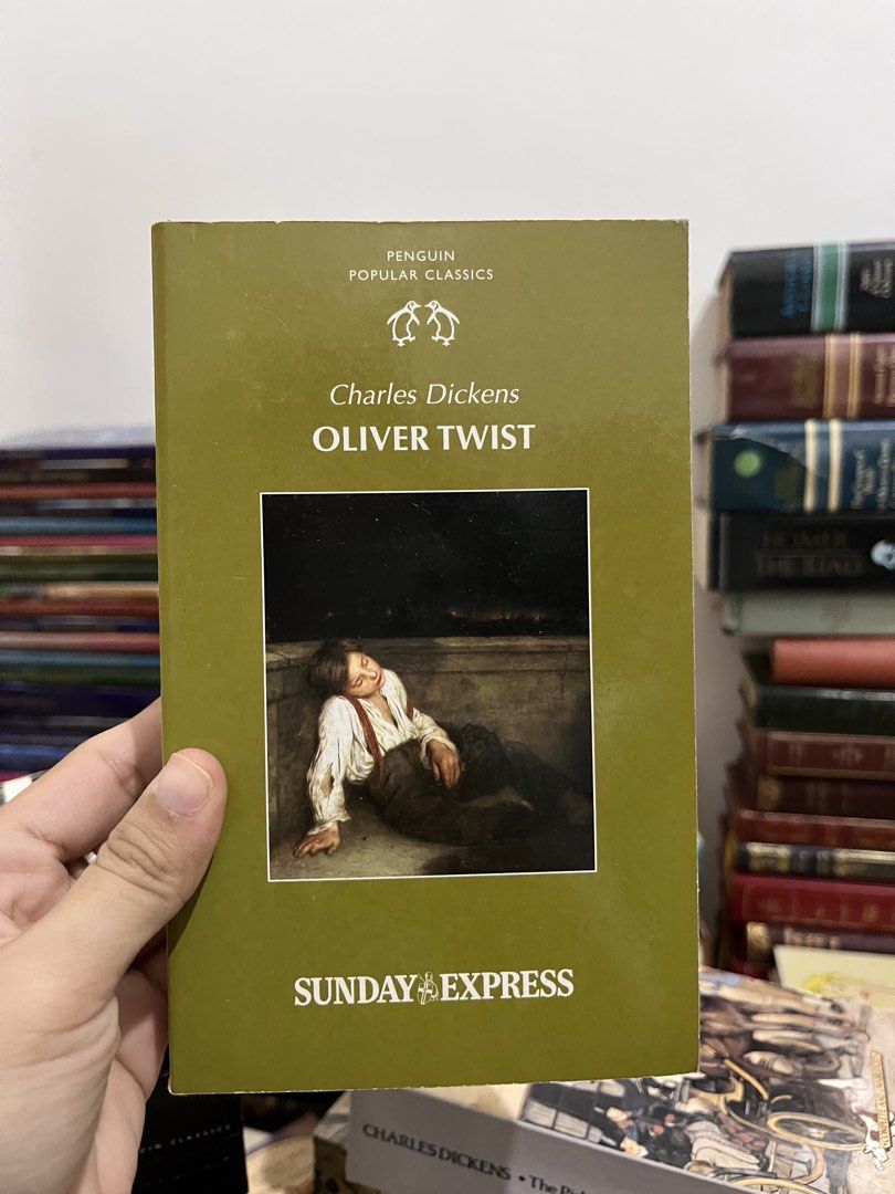 (Classic) Oliver Twist by Charles Dickens (Category: Storybooks) located in Maragondon. Submitted by quilljoylibrary (Listing ID 1436979394, Image 1). Description: - Oliver Twist by Charles Dickens - Penguin Popular Classics edition - Cover illustration of a young boy - Published by Sunday Express - A classic novel for your collection.