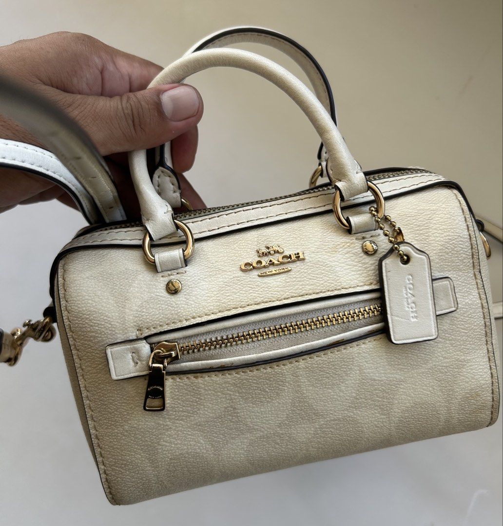 Coach Mini Rowan Satchel Crossbody Bag (Category: Luxury Bags & Wallets) located in Cagayan de Oro. Submitted by aljay02 (Listing ID 1437014448, Image 3). Description: - Authentic Coach Mini Rowan Satchel - White and beige signature Coach print - Detachable and adjustable crossbody strap - Top handles - Zip closure - Gold-tone hardware - Includes Coach hangtag.