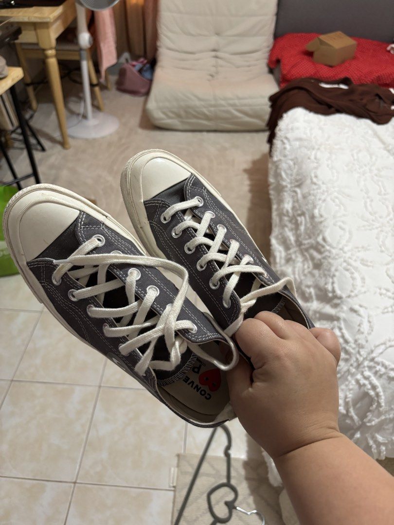 Converse x Comme des Garcons Play Chuck 70 Low (Category: Sneakers) located in Iba. Submitted by rcgpreloves (Listing ID 1436875637, Image 1). Description: - Converse x Comme des Garcons Play Chuck 70 Low - Color: Gray - Iconic heart logo - Size: US Women's 7 - Made in Vietnam - White laces and toe cap - Some wear on soles.