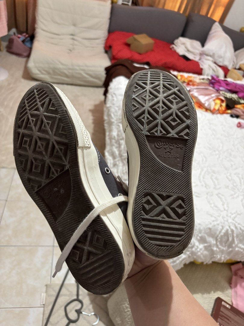 Converse x Comme des Garcons Play Chuck 70 Low (Category: Sneakers) located in Iba. Submitted by rcgpreloves (Listing ID 1436875637, Image 2). Description: - Converse x Comme des Garcons Play Chuck 70 Low - Color: Gray - Iconic heart logo - Size: US Women's 7 - Made in Vietnam - White laces and toe cap - Some wear on soles.