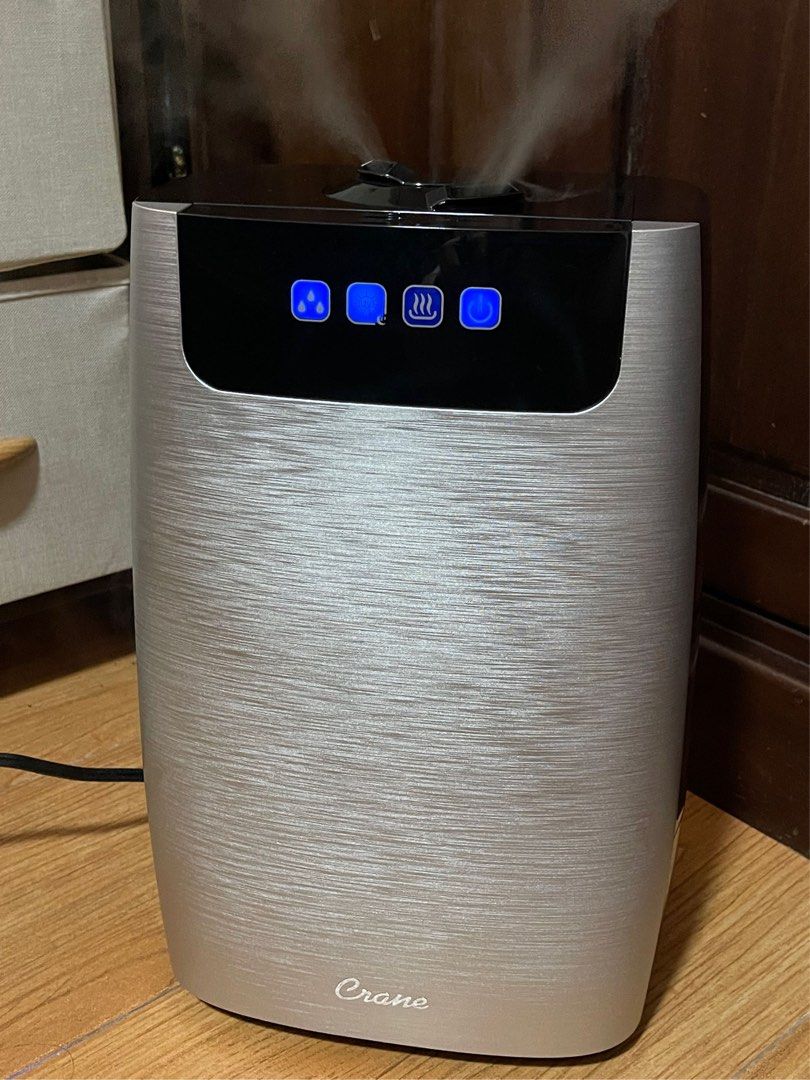 Crane 4-in-1 True HEPA Humidifier (Category: Air Purifiers & Dehumidifiers) located in Manila. Submitted by daismurous29294 (Listing ID 1436871696, Image 2). Description: This appliance appears to be a Crane 4-in-1 True HEPA Humidifier. It offers both cool and warm mist options to help relieve congestion and skin dryness. The unit includes a UV light function designed to reduce airborne bacteria and mold spores. It features a True HEPA filter to 