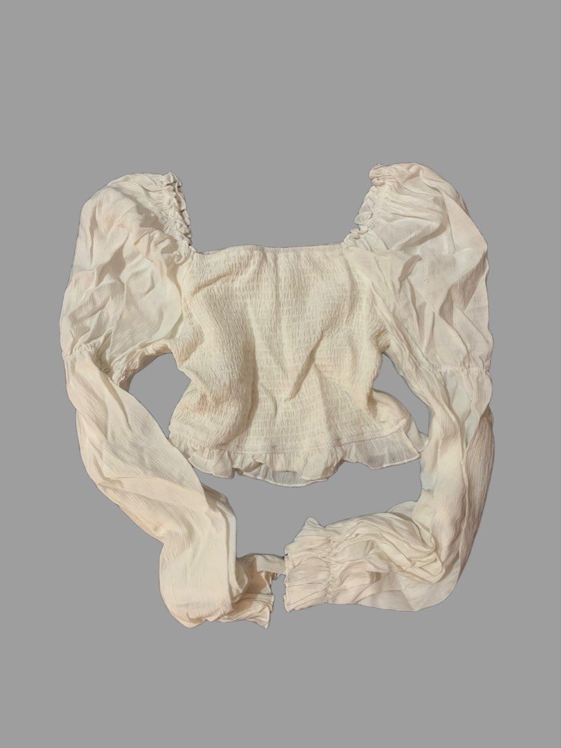 Cream Puff Sleeve Crop Top (Category: Blouses) located in Naga. Submitted by cydie.finds (Listing ID 1437009148, Image 2). Description: SHEIN top for sale 🤍 * Square neckline * Long puff sleeves * Ruffled hem * Tie detail at bust * Shirred back panel * Lightweight textured fabric ✨ Only worn once, still in excellent condition Bought for ₱599, selling for ₱450 Price can still be discussed .