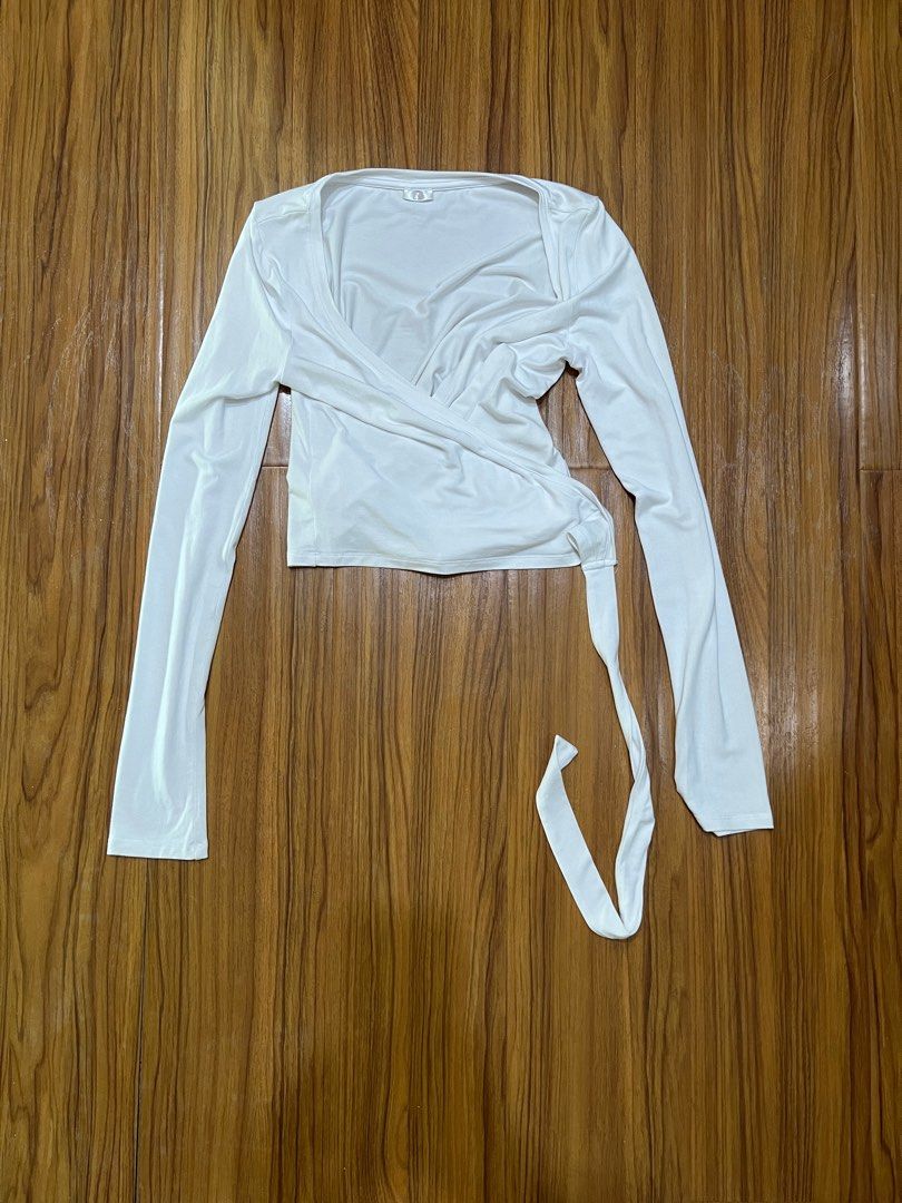 CSB White Ballet Wrap Top | Size S |BRANDNEW (Category: Activewear) located in Manila. Submitted by everythingbrandedpreloved_ (Listing ID 1436878153, Image 3). Description: Brand: CSB (AUS) Condition: Brandnew without tags (washed, no inclusions) Size: Size Small (S), fits true to size with a slightly fitted silhouette • Classic white ballet-inspired wrap top with elegant crossover design • Soft, feminine silhouette that flatters the waist and n
