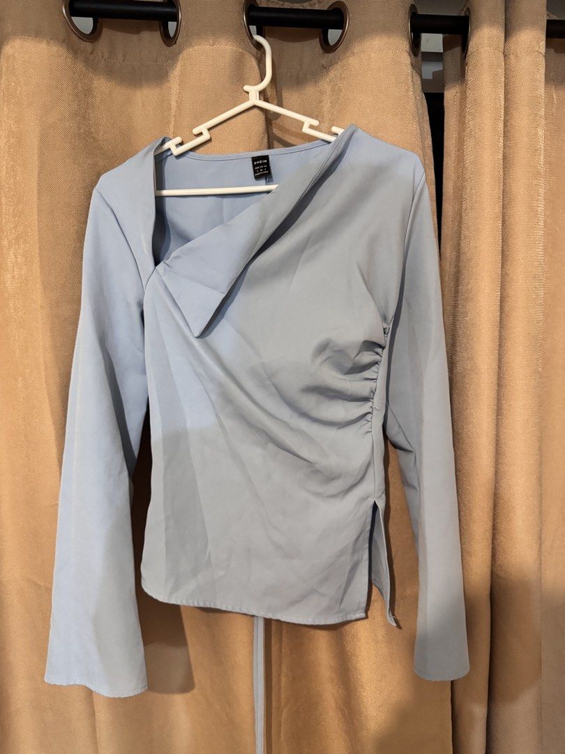 Elenzga Blue Long Sleeve Top (Category: Blouses) located in Manila. Submitted by naomis_room (Listing ID 1436963269, Image 1). Description: - Elenzga blue long-sleeved top - Asymmetrical neckline - Cinched waist - Lace-up back for adjustable fit - Flared sleeves - Perfect for a chic look - FITS S-M, super elegant.