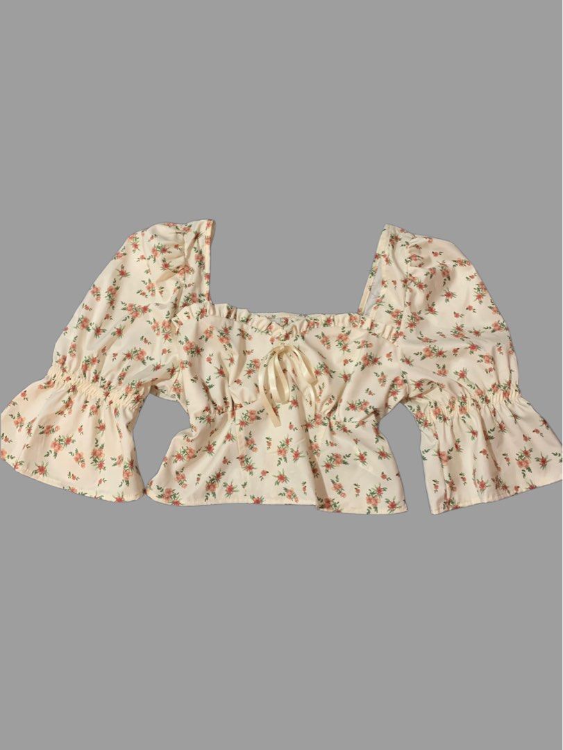 Floral Puff Sleeve Blouse (Category: Blouses) located in Naga. Submitted by cydie.finds (Listing ID 1437009177, Image 1). Description: Cream floral blouse for sale 🤍 * Square neckline * Puff sleeves * Tie detail at bust * Gathered waist & flared cuffs Only worn once, still in great condition ✨ Selling for ₱250 .