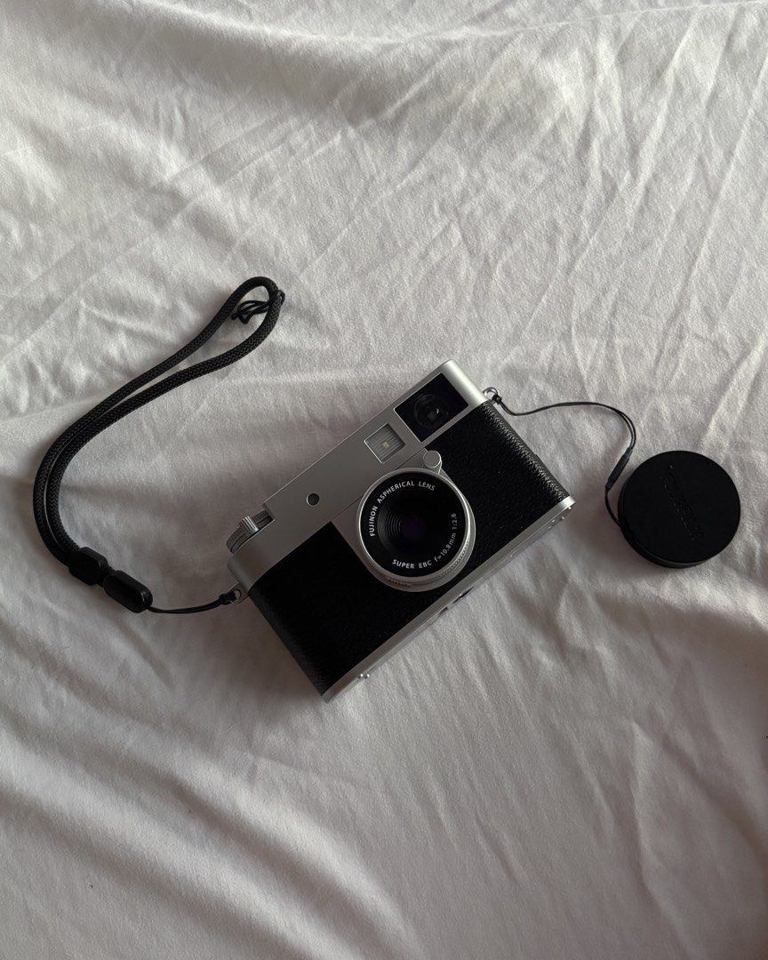 Fujifilm X-Half Digital Camera (Category: Cameras) located in Manila. Submitted by yurideclutter (Listing ID 1436935774, Image 1). Description: - Fujifilm X-Half digital camera - Black leather grip and silver top - Orig price when bought is 40K - touchscreen display - with box, straps, bag, etc. - Like new, used only a few times - No scratches whatsoever, well taken care of - Bluetooth - Includes lens cap and wrist strap - Features viewfinder and