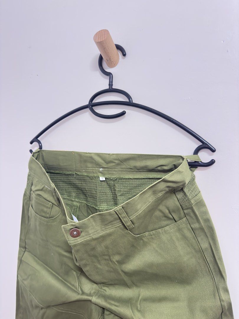 Green Patchwork Pants (Category: Jeans) located in Manila. Submitted by hutfris (Listing ID 1436904959, Image 2). Description: - Green pants with patchwork knee design - Button closure - Includes pockets - Made of durable fabric - Stylish and practical.