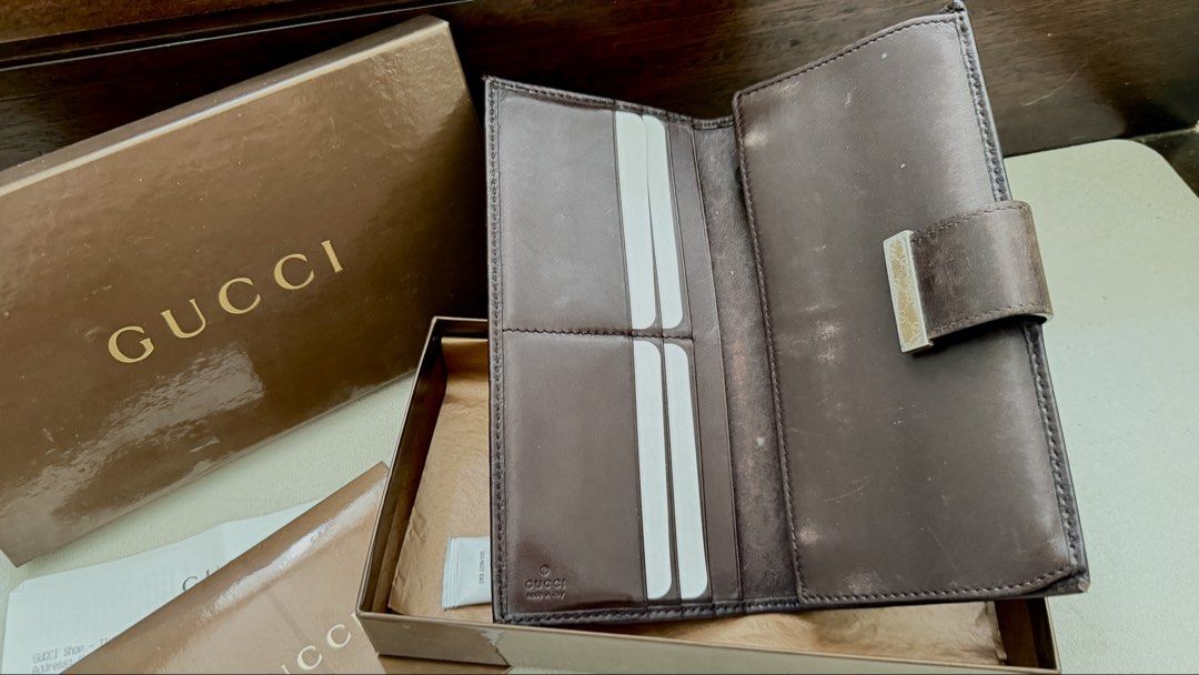 Gucci Brown Leather Wallet Original (Category: Luxury Bags & Wallets) located in Manila. Submitted by a_o_c (Listing ID 1436855961, Image 3). Description: - Authentic Gucci wallet - Brown leather with GG monogram - Includes original box and paperwork - Multiple card slots - Bill compartment - Gold-tone Gucci logo clasp - Made in Italy.