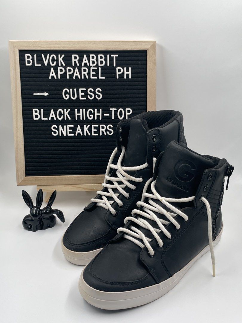 Guess Black High-Top Sneakers (Category: Sneakers) located in Caloocan City. Submitted by blvck_rabbit_ph (Listing ID 1436913648, Image 1). Description: 👟 : Guess high-top sneakers in black 🏷️ : Lightly used Guess sneakers. Decluttering the closet that’s why we’re selling this. - No issues - No box included - White laces - Side zipper detail - White sole - Guess logo on the side - Quilted design on the back 📐 : US 8.5 💰: BPI, Gcash, Maya, Cas