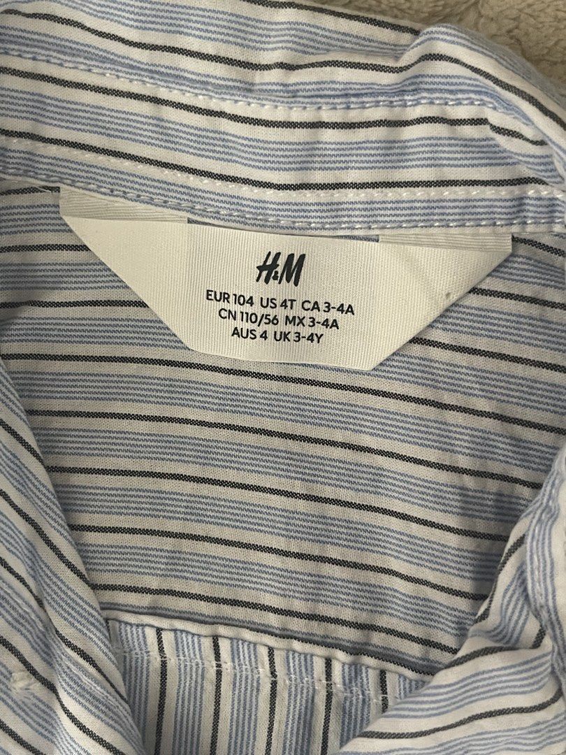 H&M Striped Long Sleeve Shirt (Category: Longsleeves) located in San Pedro. Submitted by cchloepreloved (Listing ID 1436861063, Image 2). Description: - H&M long sleeve shirt - Classic striped design - Size: 4T - Collared neckline - Button-down closure - Long sleeves with buttoned cuffs - Lightweight fabric - Suitable for everyday wear.