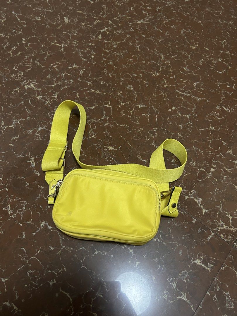 H&M Yellow Crossbody Bag (Category: Cross-body Bags) located in Makati City. Submitted by tam72 (Listing ID 1436965720, Image 1). Description: - H&M crossbody bag - Bright yellow color - Double-zippered main compartment - Adjustable strap - Rectangular shape - Smooth, shiny texture - Light beige interior - Perfect for everyday use - Need wash.
