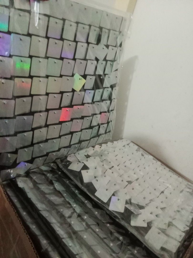 Iridescent Square Wall Panel (Category: Wall Decor) located in Valenzuela. Submitted by chris_cruz (Listing ID 1436921913, Image 2). Description: LOCATION: Deparo North Caloocan - New, unused wall panel. - Features iridescent square tiles. - Tiles reflect multiple colors. - Black backing. - Suitable for decorative use. - Wrapped in plastic. -35 pcs -PRICE: Negotiable.