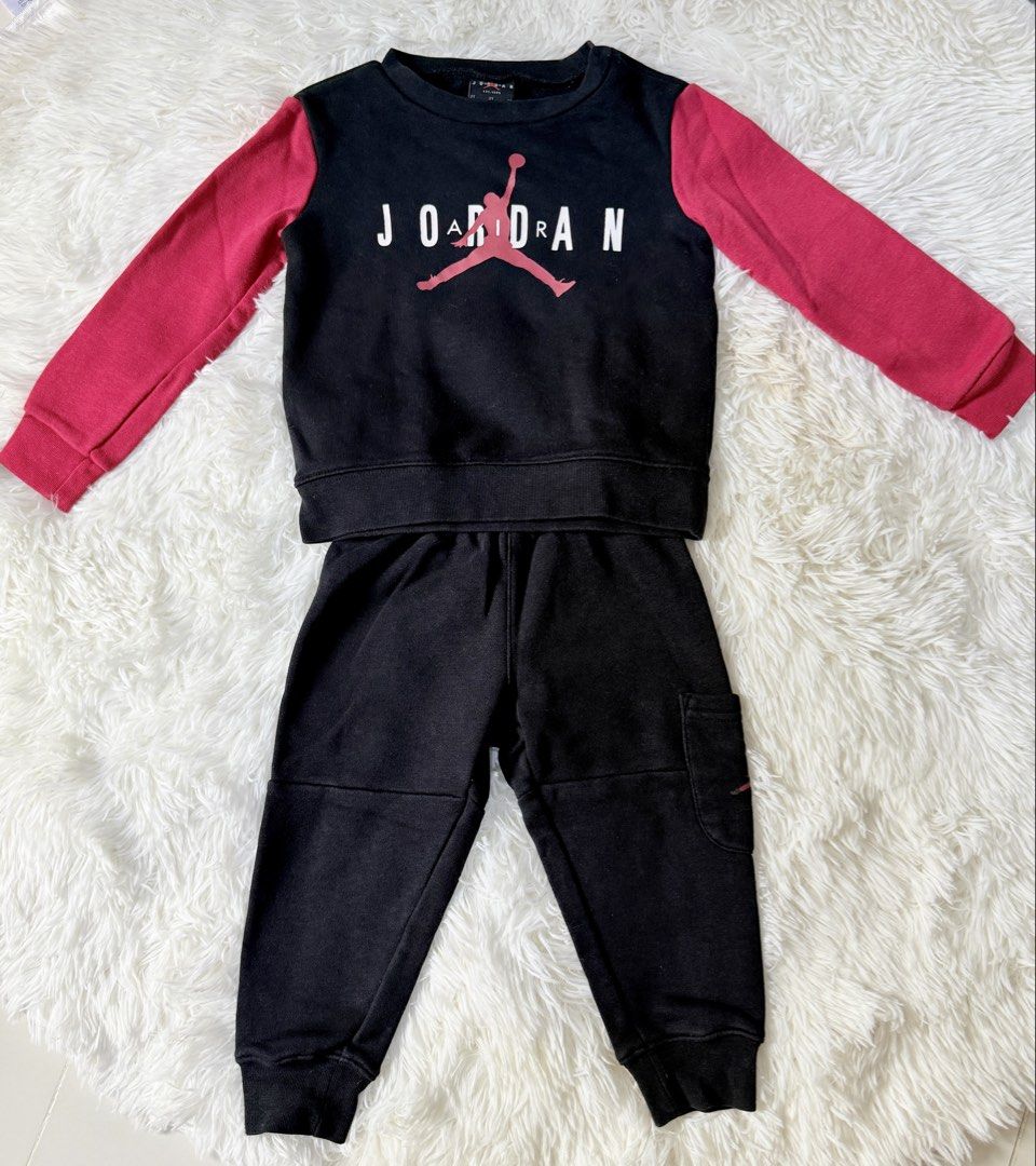 Original Jordan Sweatshirt and Jogger Set - 2T (Category: Babies & Kids Fashion) located in Bulacan. Submitted by ta.klowset (Listing ID 1436868156, Image 1). Description: - Jordan 2-piece set (size 2T). - Includes a black sweatshirt with red sleeves and black joggers. - Sweatshirt features the Jordan logo. - Joggers have a small pocket. - Perfect for your little one's comfort and style..