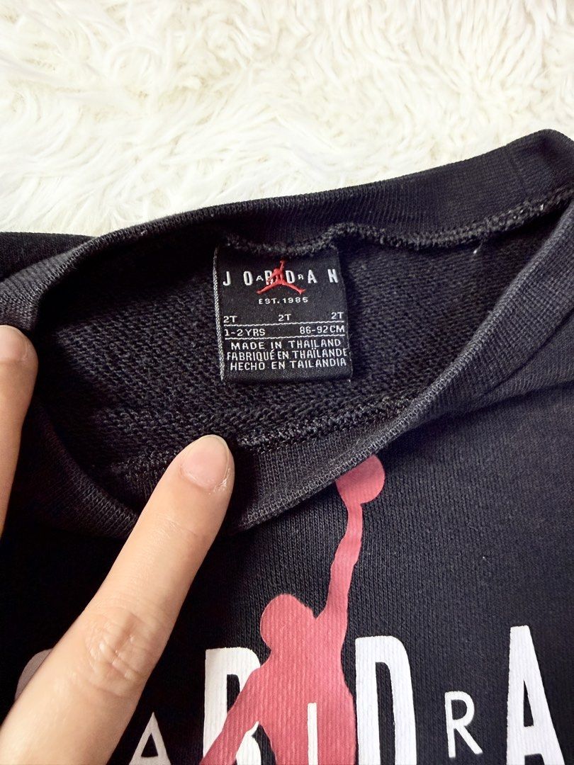 Original Jordan Sweatshirt and Jogger Set - 2T (Category: Babies & Kids Fashion) located in Bulacan. Submitted by ta.klowset (Listing ID 1436868156, Image 2). Description: - Jordan 2-piece set (size 2T). - Includes a black sweatshirt with red sleeves and black joggers. - Sweatshirt features the Jordan logo. - Joggers have a small pocket. - Perfect for your little one's comfort and style..