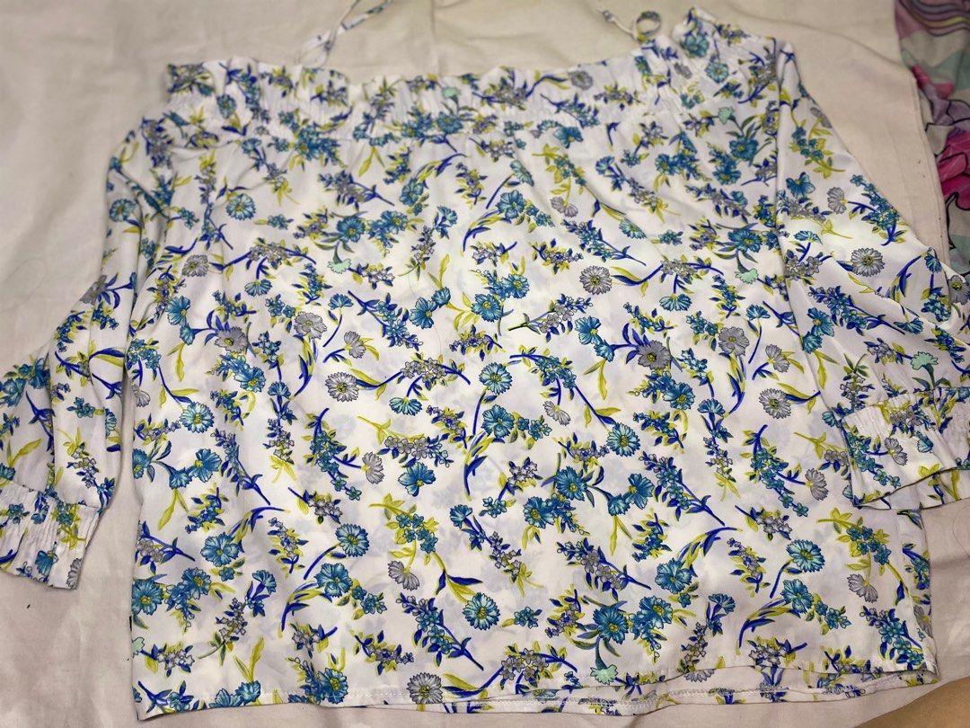 Kamiseta plus size Floral Off-Shoulder Blouse (Category: Blouses) located in Cebu City. Submitted by candy_ytal (Listing ID 1436859237, Image 1). Description: - Floral off-shoulder blouse - Color: Blue and white - Size: XL to 4XL (super stretcheable) - Features long sleeves with ruffled cuffs - Adjustable straps - Lightweight fabric - Relaxed, comfortable fit - Ideal for warm weather.