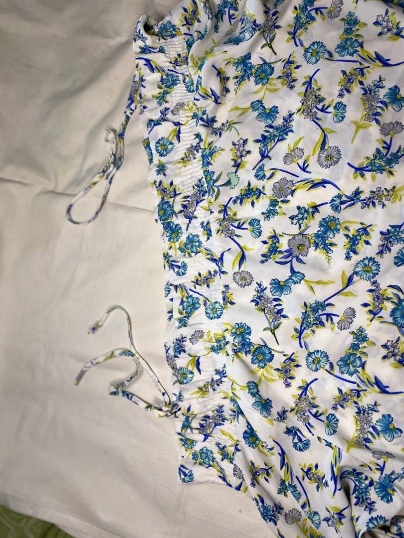 Kamiseta plus size Floral Off-Shoulder Blouse (Category: Blouses) located in Cebu City. Submitted by candy_ytal (Listing ID 1436859237, Image 3). Description: - Floral off-shoulder blouse - Color: Blue and white - Size: XL to 4XL (super stretcheable) - Features long sleeves with ruffled cuffs - Adjustable straps - Lightweight fabric - Relaxed, comfortable fit - Ideal for warm weather.
