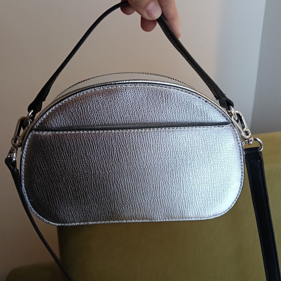 Karl Lagerfeld Silver Crossbody Bag (Category: Cross-body Bags) located in Mandaluyong City. Submitted by hailey143 (Listing ID 1436978017, Image 3). Description: - Karl Lagerfeld crossbody bag - Silver exterior with unique graphic design - Black strap and top handle - Black interior with small pocket - Comes with tags and a small card - Style: LH1EU9AI - MSRP: $198.00 - used once - RFS: 2 po pinadala sa akin 😊 .