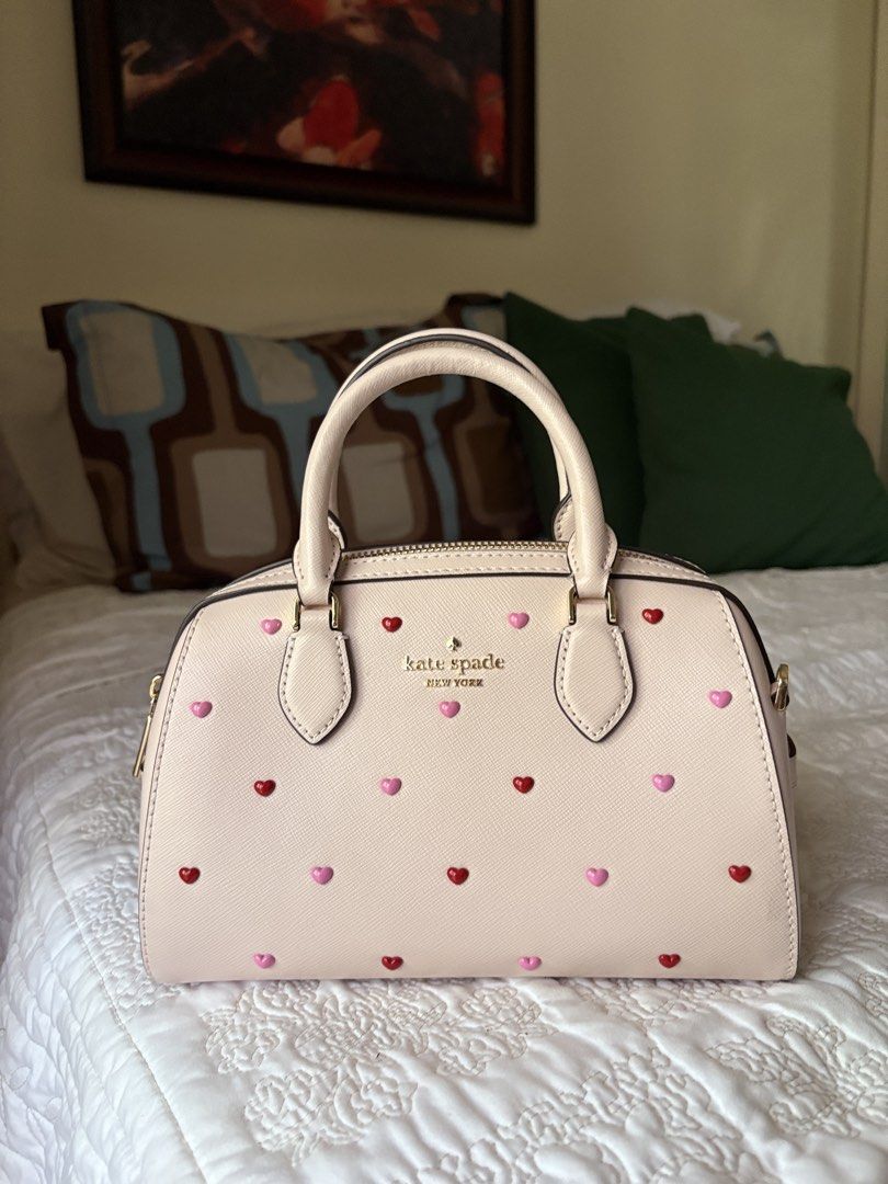 Kate Spade Heart Bag (Category: Luxury Bags & Wallets) located in Pasig City. Submitted by buttercinnamoroll (Listing ID 1436875530, Image 1). Description: -Handbag/Crossbody (w sling) -Only used once. Still in pristine condition. -Pm if you want more pics -Authentic from 🇺🇸 .