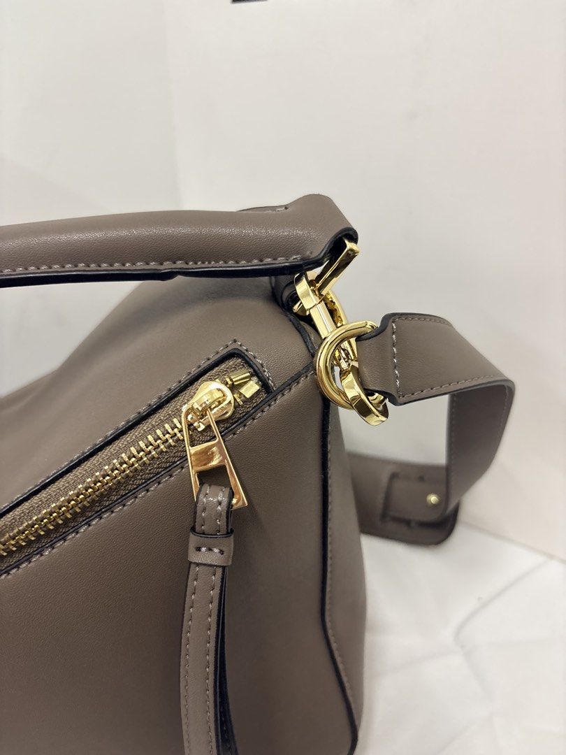 Loewe puzzle bag in taupe small (Category: Luxury Bags & Wallets) located in Quezon City. Submitted by herluxe_official (Listing ID 1436973805, Image 3). Description: .
