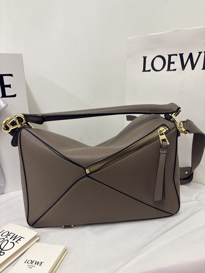 Loewe puzzle bag in taupe small (Category: Luxury Bags & Wallets) located in Quezon City. Submitted by herluxe_official (Listing ID 1436973805, Image 2). Description: .