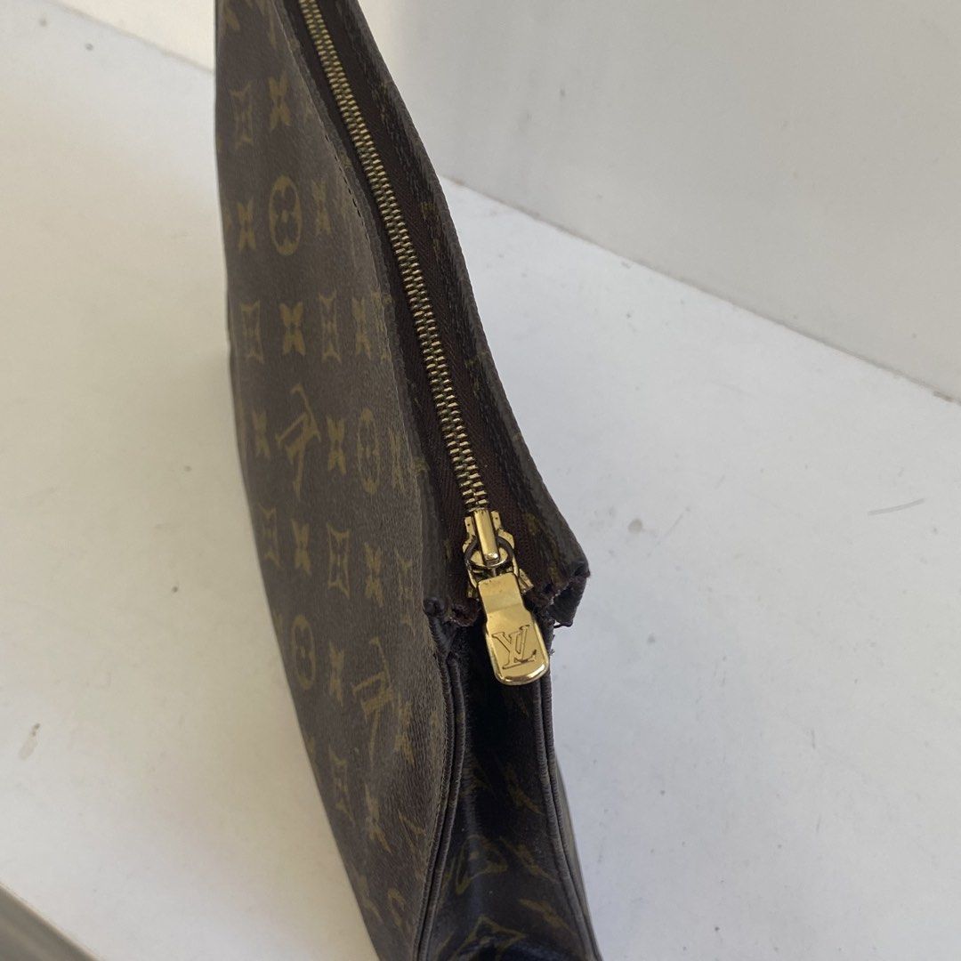 Louis Vuitton Monogram Clutch (Category: Luxury Bags & Wallets) located in Manila. Submitted by eddjohn (Listing ID 1436925633, Image 3). Description: - Authentic Louis Vuitton Monogram clutch - Features the iconic LV monogram pattern - Gold-tone zipper pull with LV logo - Interior color: light beige - Made in France.