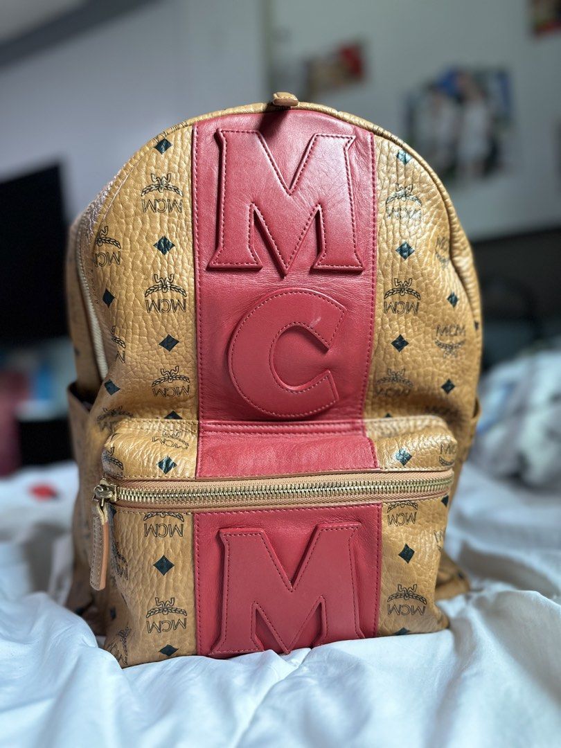 Mcm stark backpack (Category: Luxury Bags & Wallets) located in Quezon City. Submitted by cookieandmilky (Listing ID 1436917630, Image 1). Description: Selling my authentic MCM backpack in cognac visetos with red leather logo detailing. Very eye-catching and rare design. Perfect as a daily luxury bag or travel bag. Details: * Authentic * Price: ₱20,000 * Color: Cognac/Red * Spacious interior * Gold-tone hardware * Adjustable straps * Comes exactl