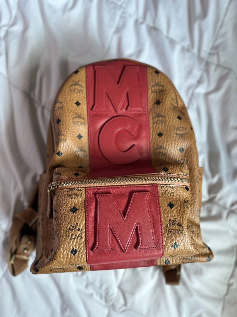 Mcm stark backpack (Category: Luxury Bags & Wallets) located in Quezon City. Submitted by cookieandmilky (Listing ID 1436917630, Image 3). Description: Selling my authentic MCM backpack in cognac visetos with red leather logo detailing. Very eye-catching and rare design. Perfect as a daily luxury bag or travel bag. Details: * Authentic * Price: ₱20,000 * Color: Cognac/Red * Spacious interior * Gold-tone hardware * Adjustable straps * Comes exactl