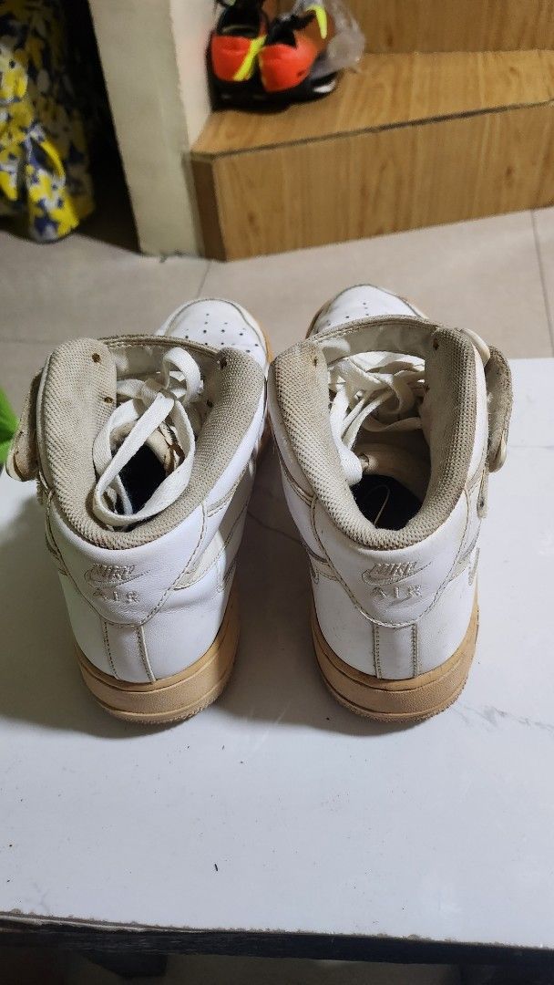 Nike Air Force 1 High Top Sneakers (Category: Sneakers) located in Caloocan City. Submitted by julsbaldo (Listing ID 1436951121, Image 3). Description: - White Nike Air Force 1 high-top sneakers - White leather upper - Beige sole - Velcro strap closure - Nike swoosh logo.